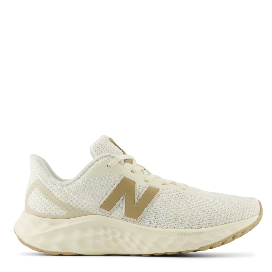 A pair of women's New Balance Fresh Foam Arishi V4 sneakers in white color with a lace-up closure and a breathable mesh upper.