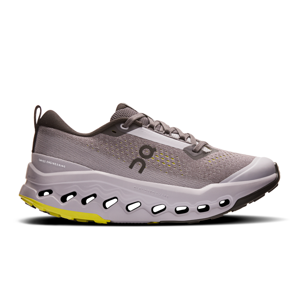 Gray running shoe with a yellow sole on a white background