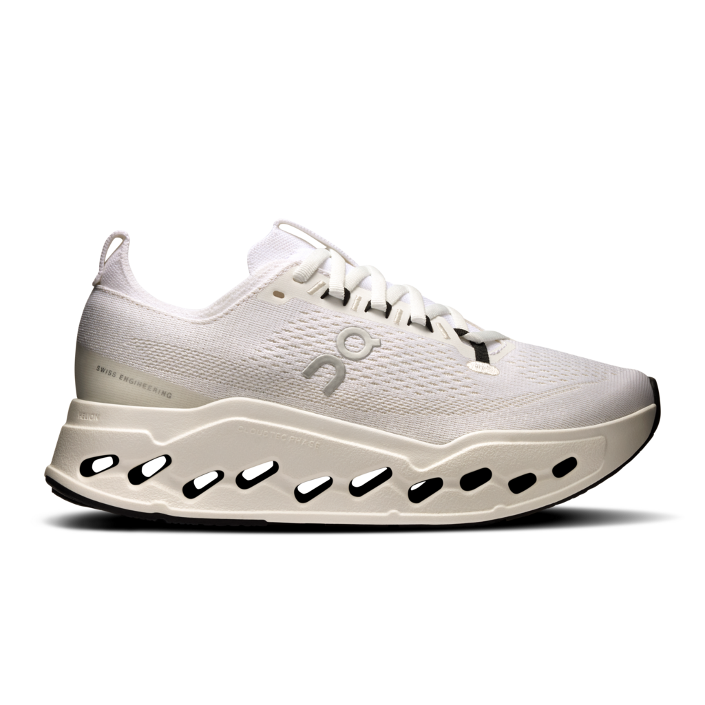 White athletic shoe with unique sole design on a white background