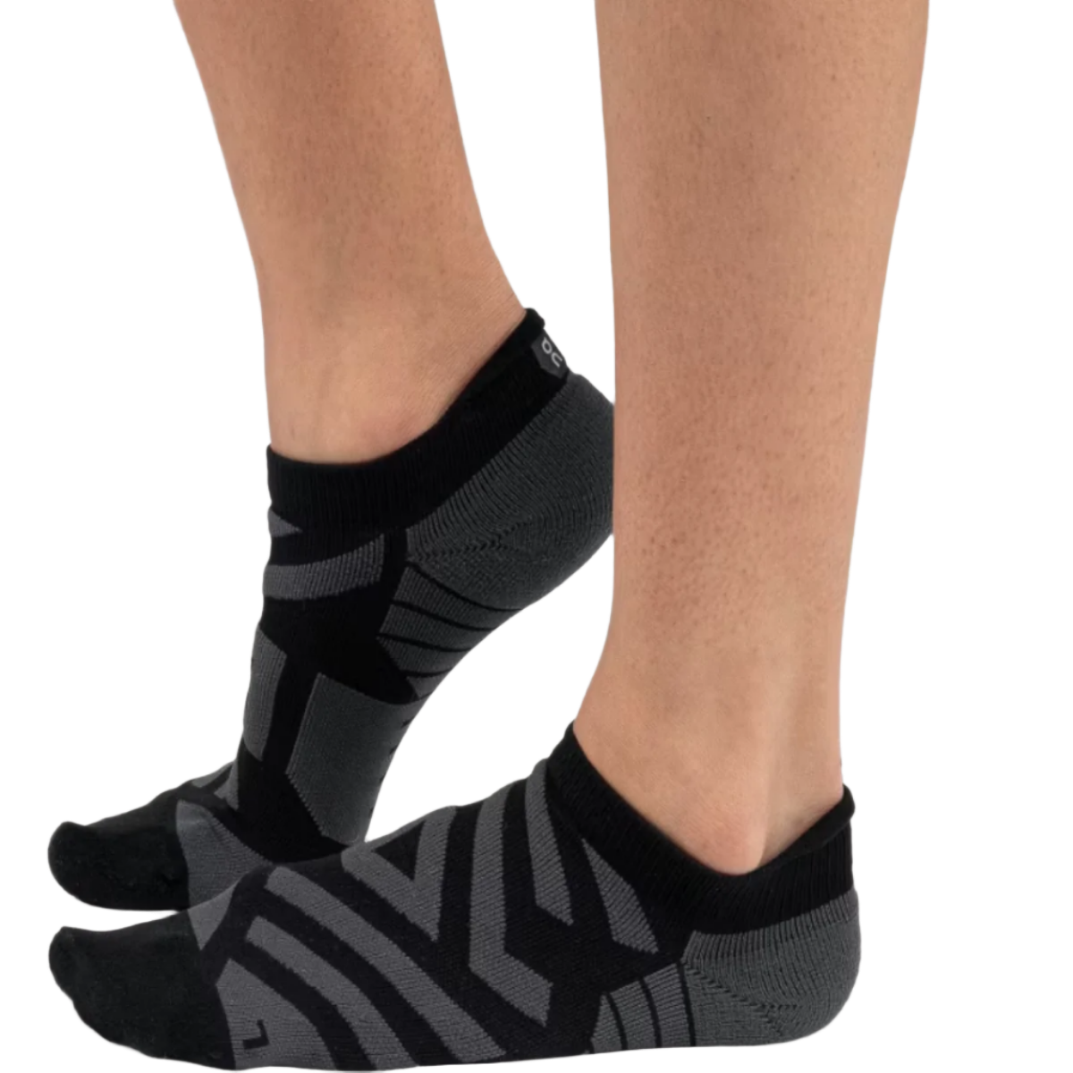 A pair of women's performance low running socks in black with a geometric pattern on the side.
