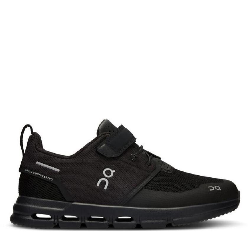 A pair of black On running sneakers designed for kids, with visible cushioning and a hook & loop closure.