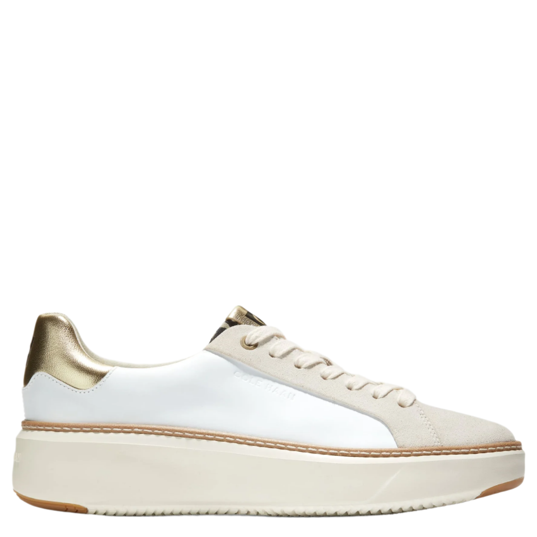 A pair of Cole Haan women's sneakers with a white leather upper, metallic gold accents, and a leopard print design.