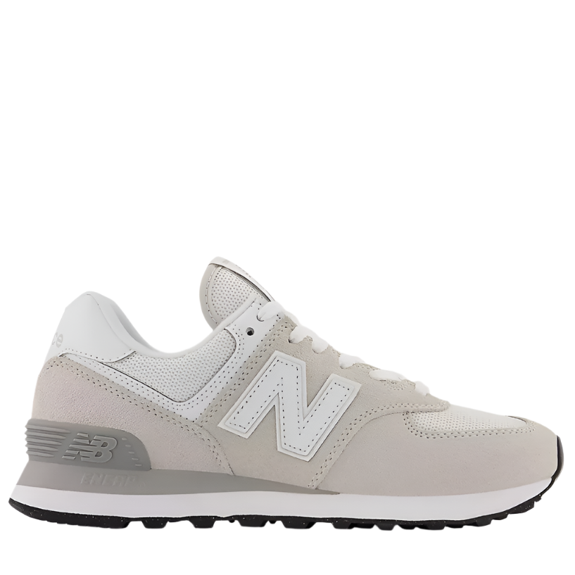 A women's New Balance 574 Core sneaker in beige color with a suede/mesh upper and a rubber outsole.