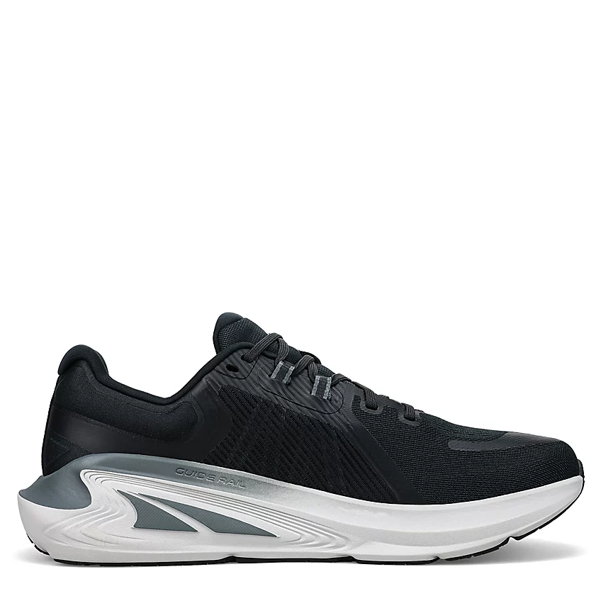 A pair of women's Altra Paradigm 7 running shoes in black color, featuring a mesh upper, ghillie lacing, and a white midsole with gray accents.