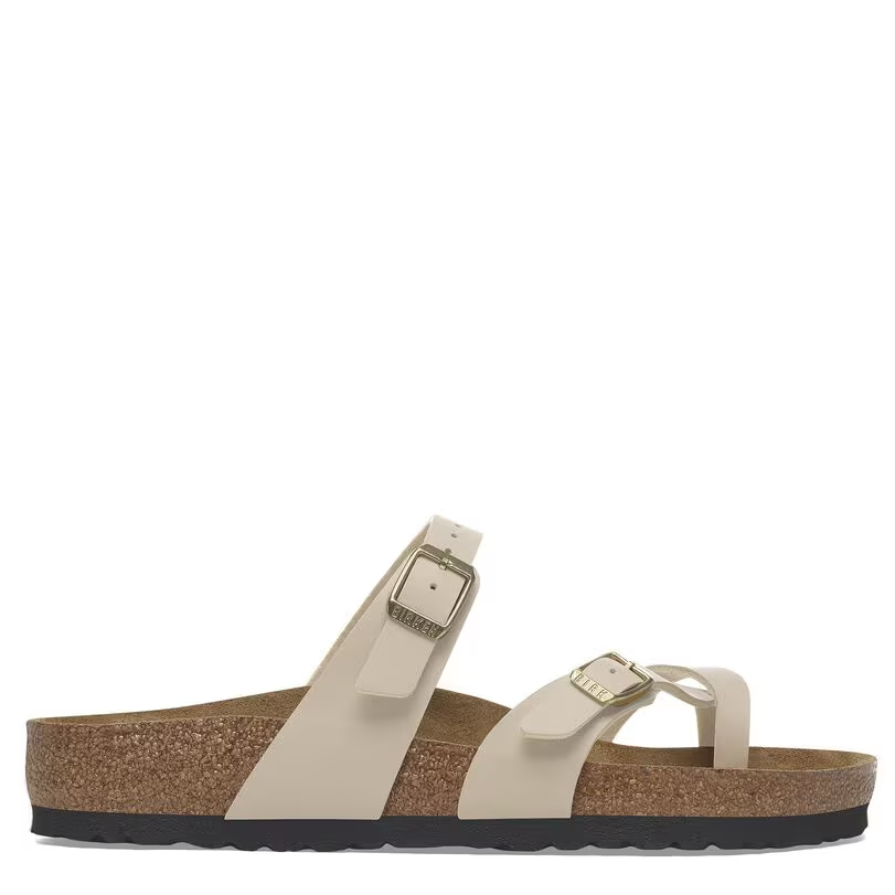 A beige Birkenstock Mayari sandal with Birko-Flor® upper, suede footbed lining, and an EVA sole, featuring two adjustable straps with metal pin buckle and a toe loop.