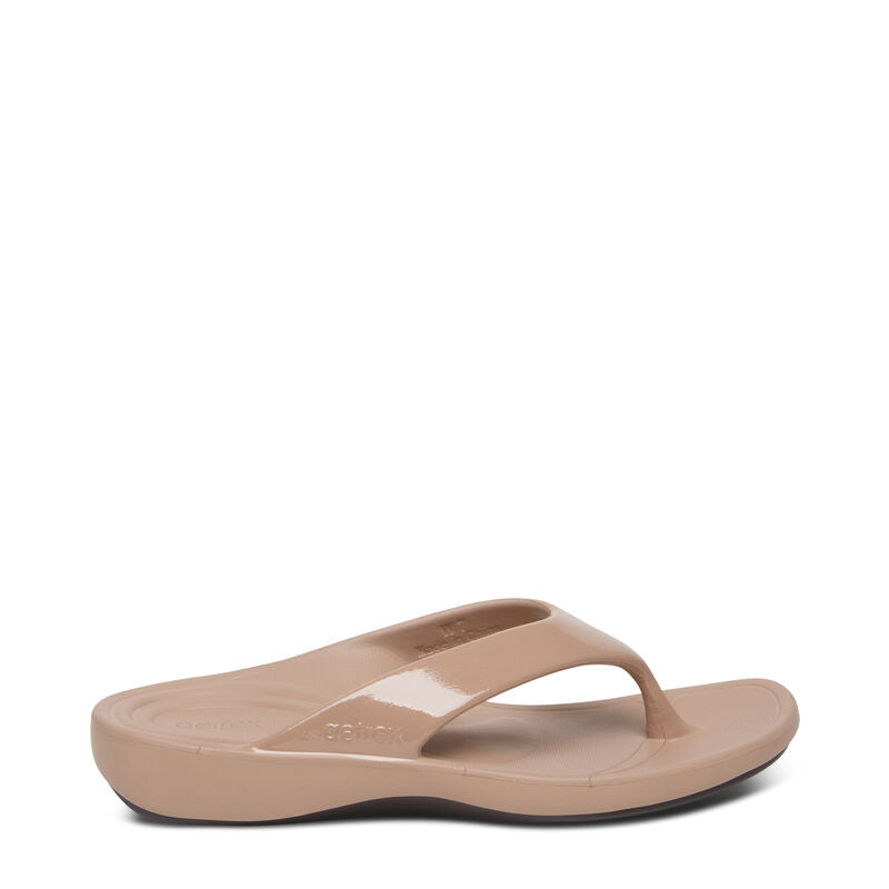 A beige-colored women's orthopedic flip flop sandal with a contoured design and soft toe post, set against a white background.