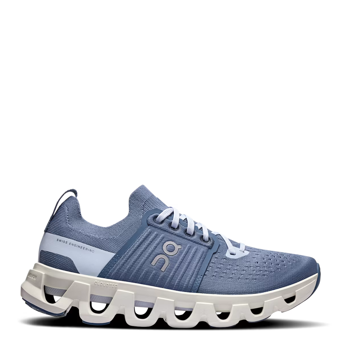 A women's road running shoe with a blue and white color scheme, featuring a perforated toe box, a cage construction, and a responsive ride design.