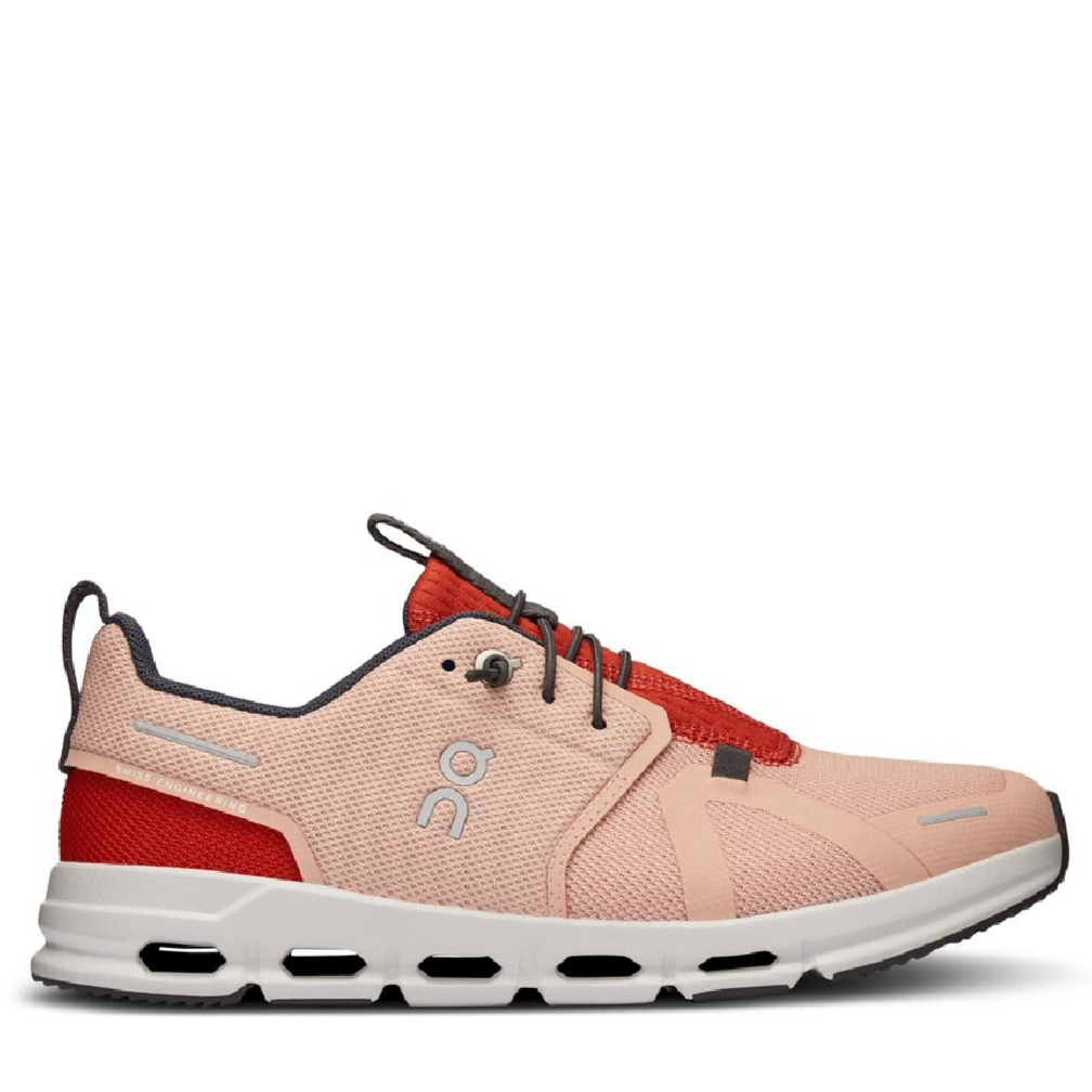 A pair of youth-sized athletic shoes in beige and red colors, designed for running and casual wear.