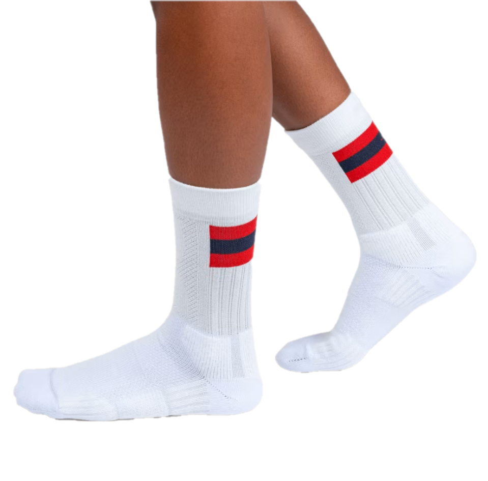 White crew length sock with red stripe
