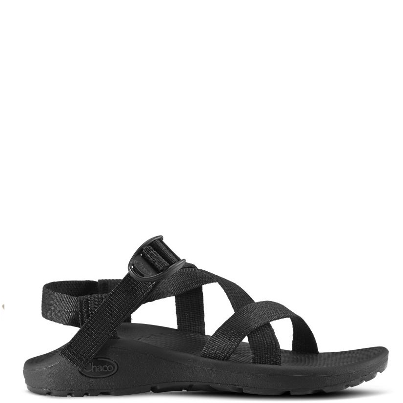 A black women's sandal with adjustable straps and a flat, cushioned sole.