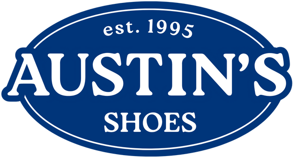 Logo of Austin's Shoes with a blue oval border 