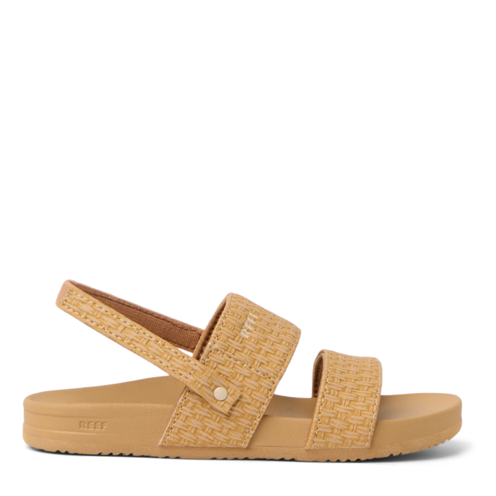 Tan sandal with woven strap on a white background