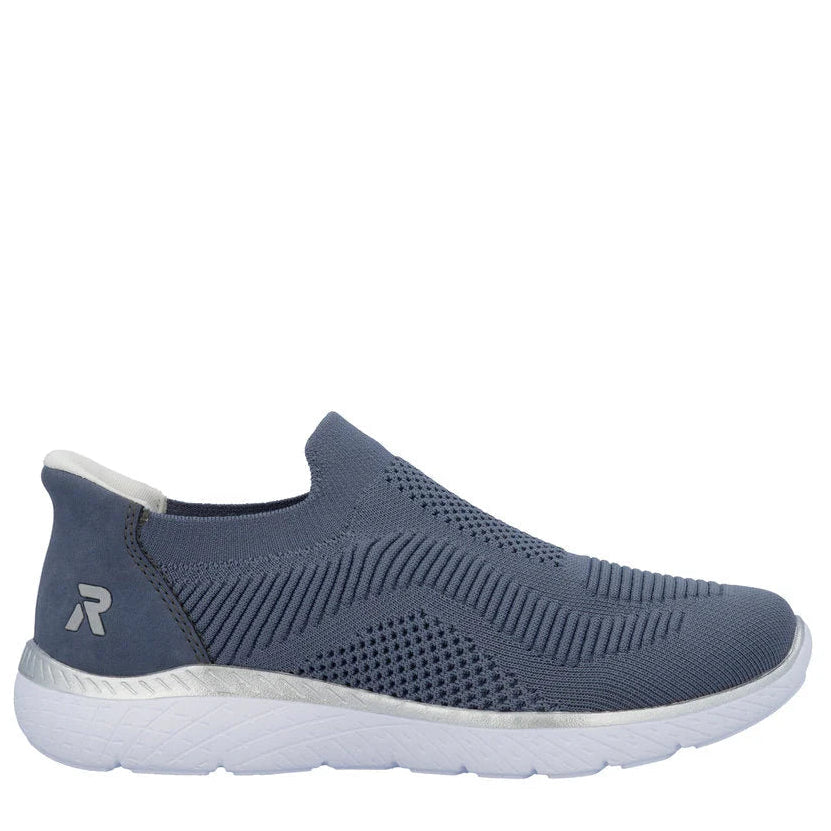 Blue slip-on sneaker with a white sole on a white background