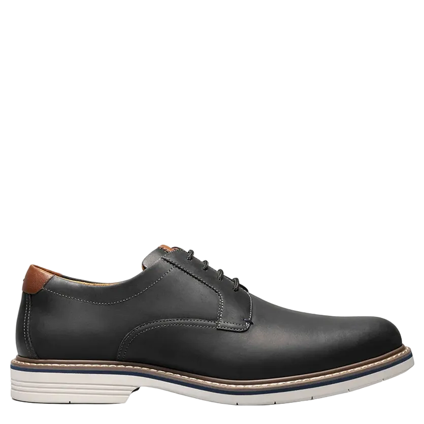 Black leather shoe on a white background