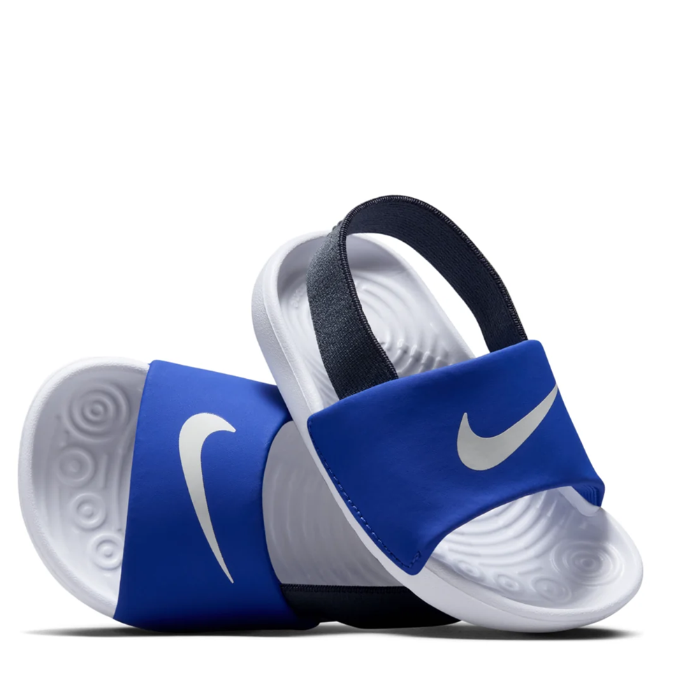 A pair of Nike slide sandals with royal blue straps, white footbeds, and a black heel strap, shown on a clean white background.
