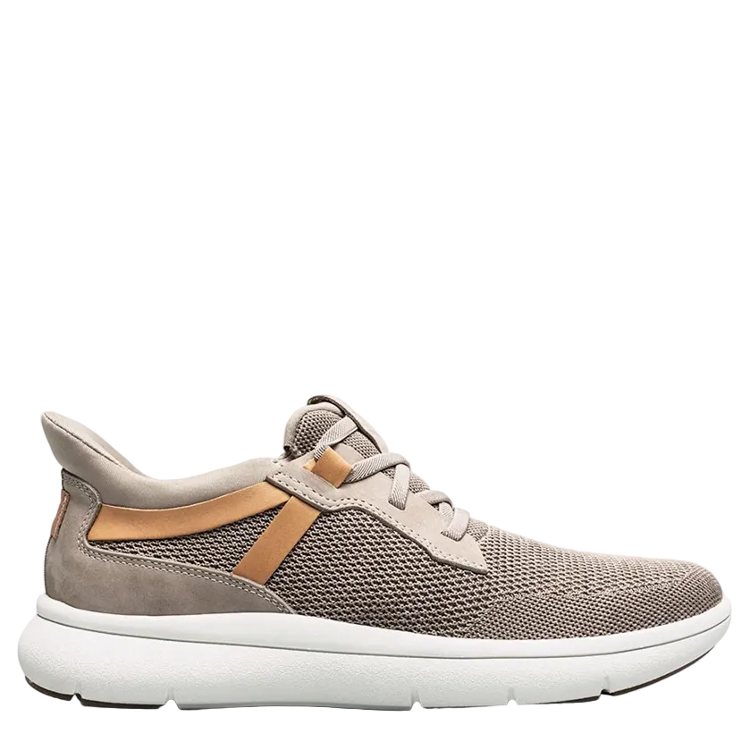 Gray sneaker with brown accents on a white background