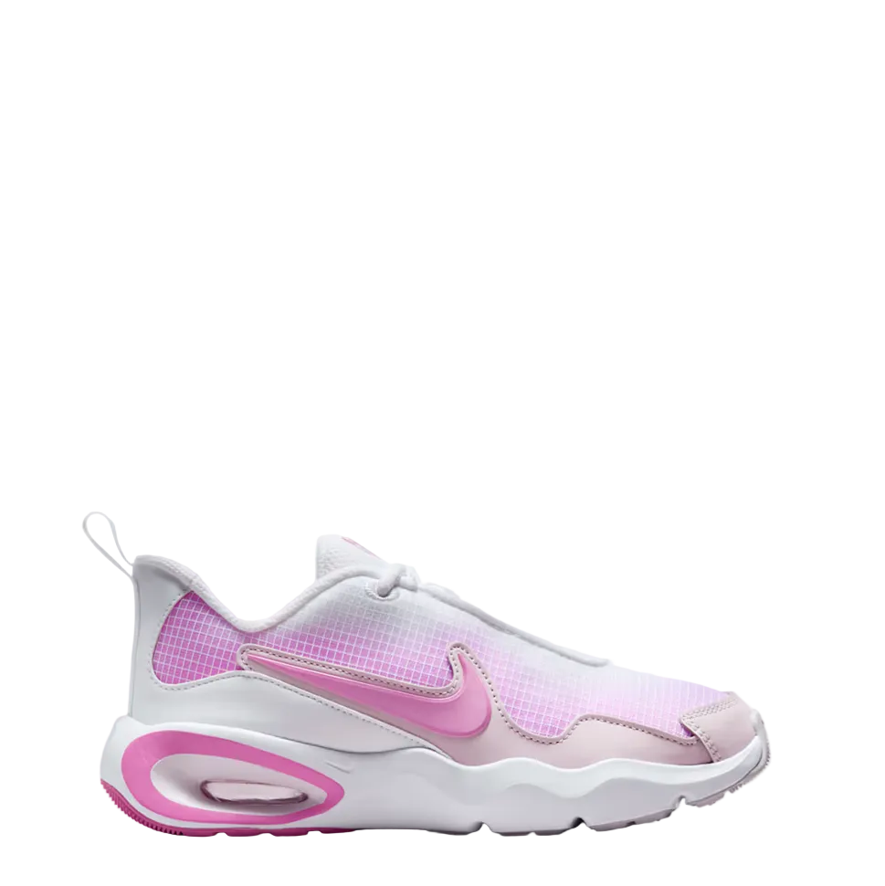A Nike sneaker in white and pink, featuring a textured mesh upper, a pink Swoosh, and a pink Air cushioning unit in the sole, shown against a light gray gradient background.
