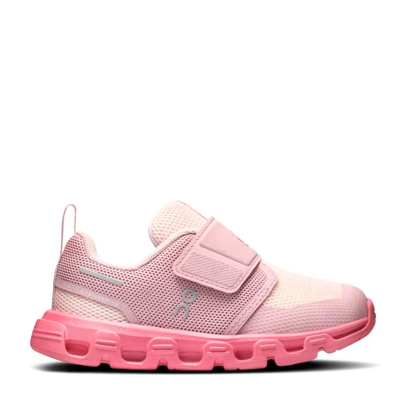 A pink mesh toddler sneaker with a hook-and-loop strap closure and a chunky pink sole, shown from the side against a plain white background.