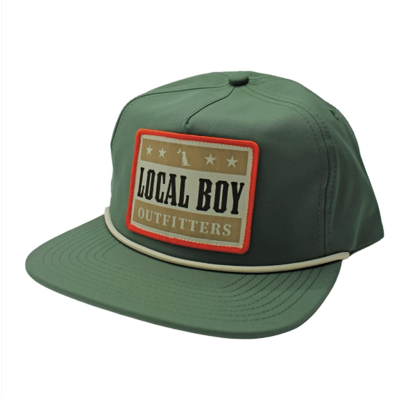A green baseball cap with a 'LOCAL BOY' patch on the front, shown on a white background.