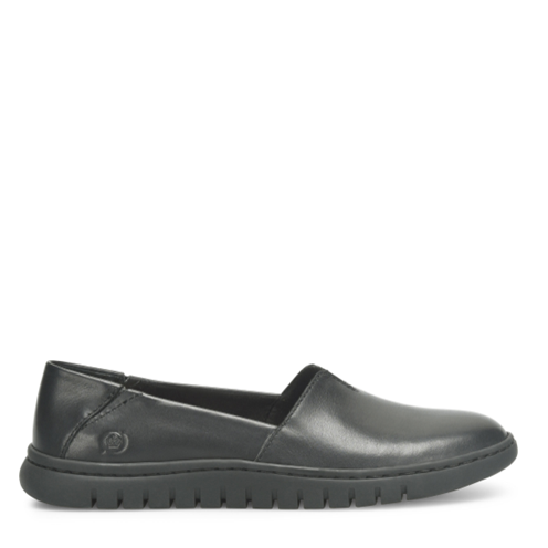 Black slip-on shoe on a white background