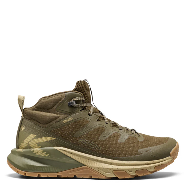 A mid-cut hiking boot in olive green and tan, featuring a textured mesh upper, lace-up closure, and a rugged sole, shown against a plain white background.