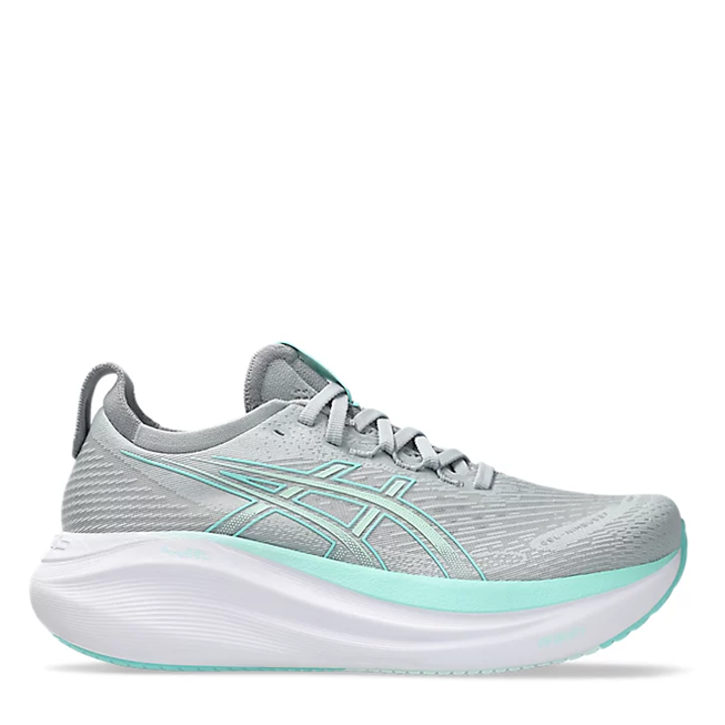 Light gray running shoe with green accents on a white background