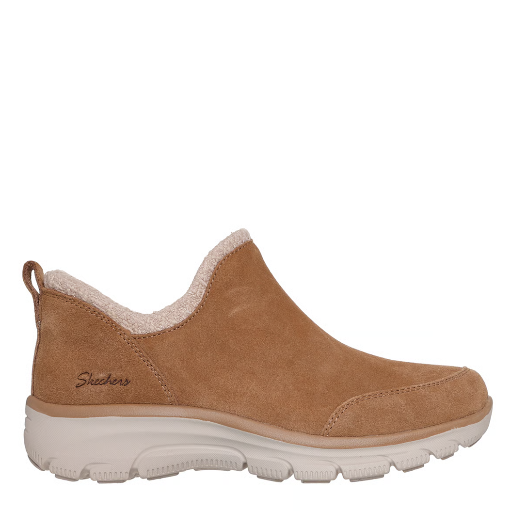 Tan shoe with white sole on a white background