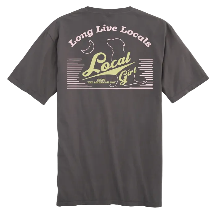 A dark gray t-shirt shown from the back, featuring a retro-style graphic print with the text 'Long Live Locals' and 'Local Girl' in cream and olive green. A yellow circular 'NEW' badge is in the top-left corner.
