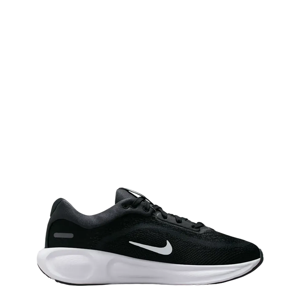 A black Nike running shoe with a white midsole and a white Swoosh logo, shown in a side profile against a light gray background.