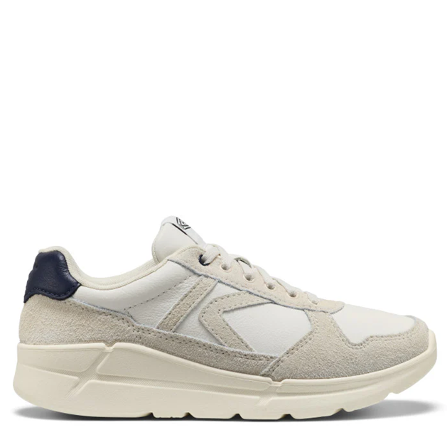 White sneaker with navy accents on a white background