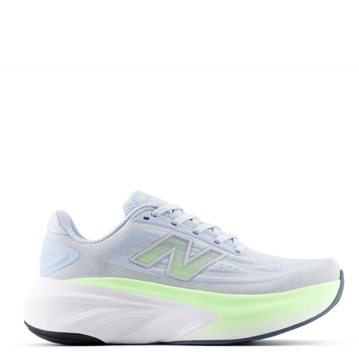 White running shoe with green accents on a white background