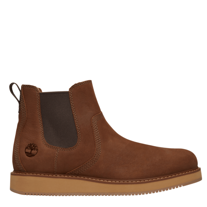 A brown suede Chelsea boot with a dark brown elastic side panel and a tan rubber sole, shown from a side profile on a white background. The Timberland logo is embossed on the side.