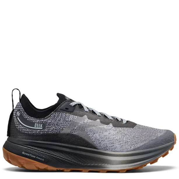 Gray and black running shoe with brown sole on a white background