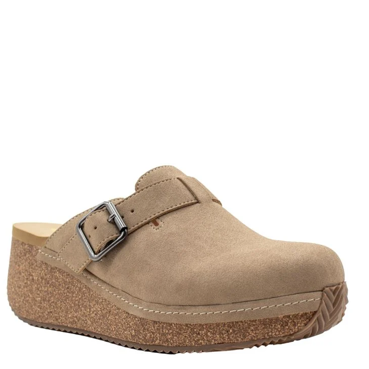 A beige faux leather mule with an adjustable buckle strap and a cork wedge heel.