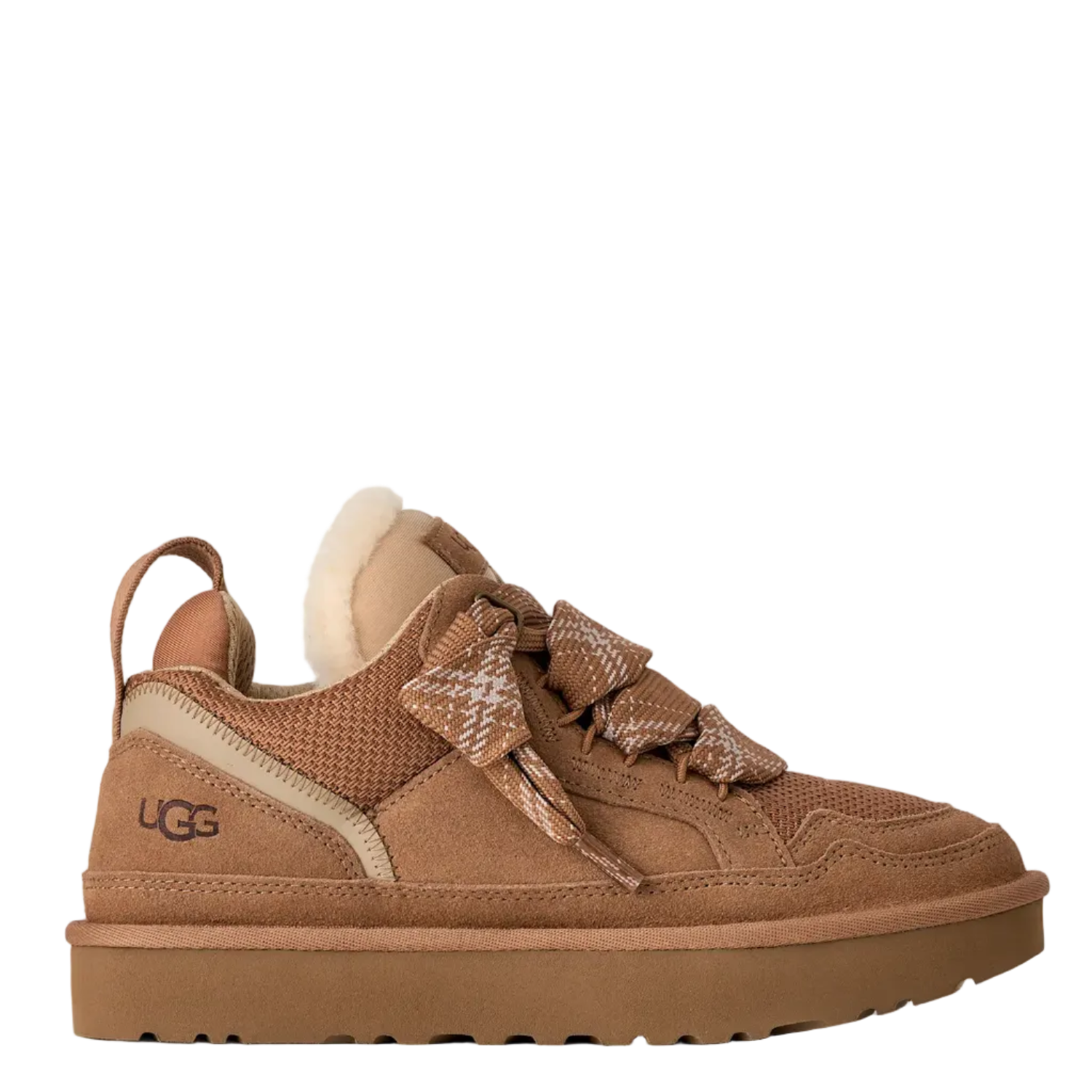 A UGG low-top sneaker in brown suede and mesh with a beige side panel, a brown patterned bow on the laces, and a cream-colored shearling lining, shown against a split white and light beige background.