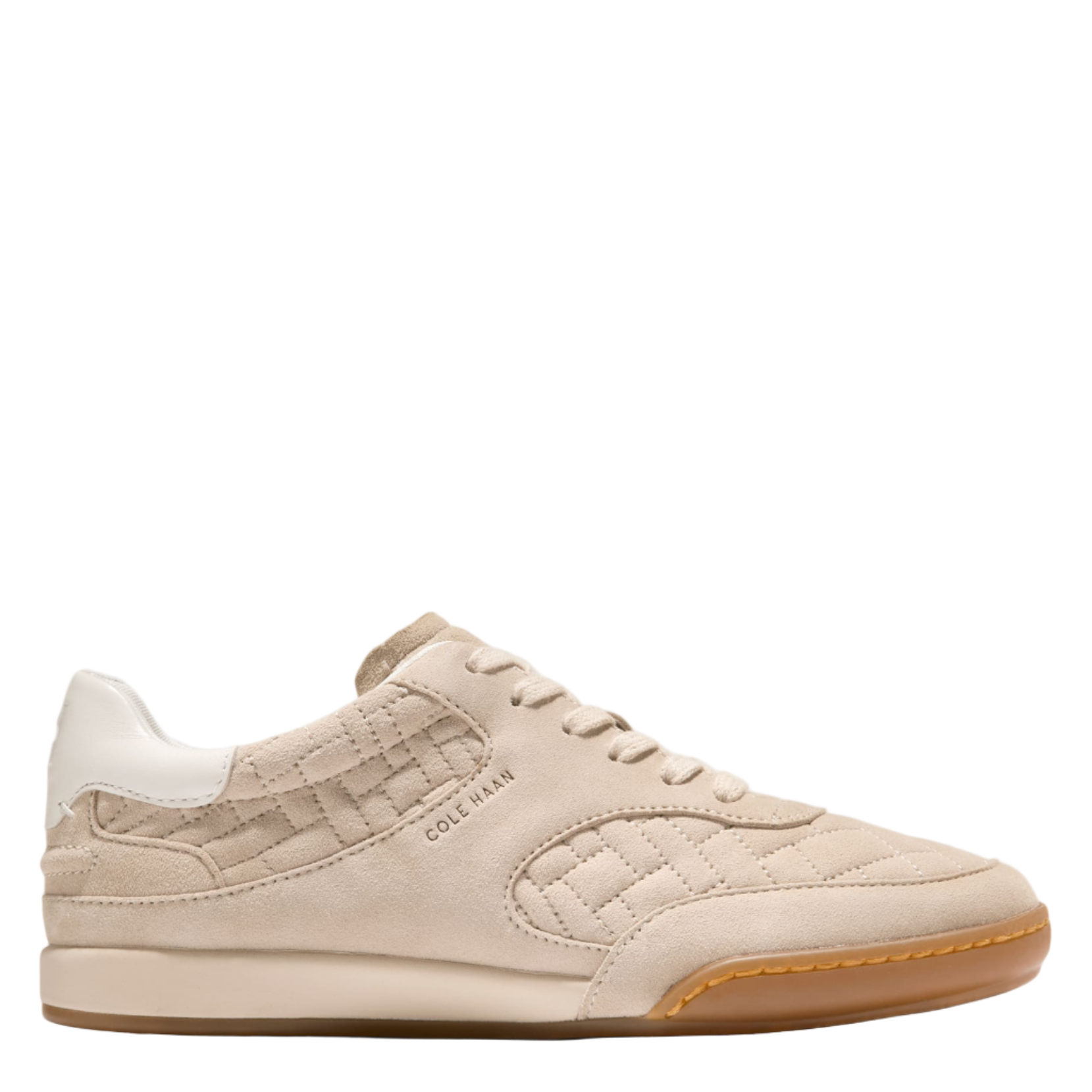 Beige sneaker with brown sole on a white background