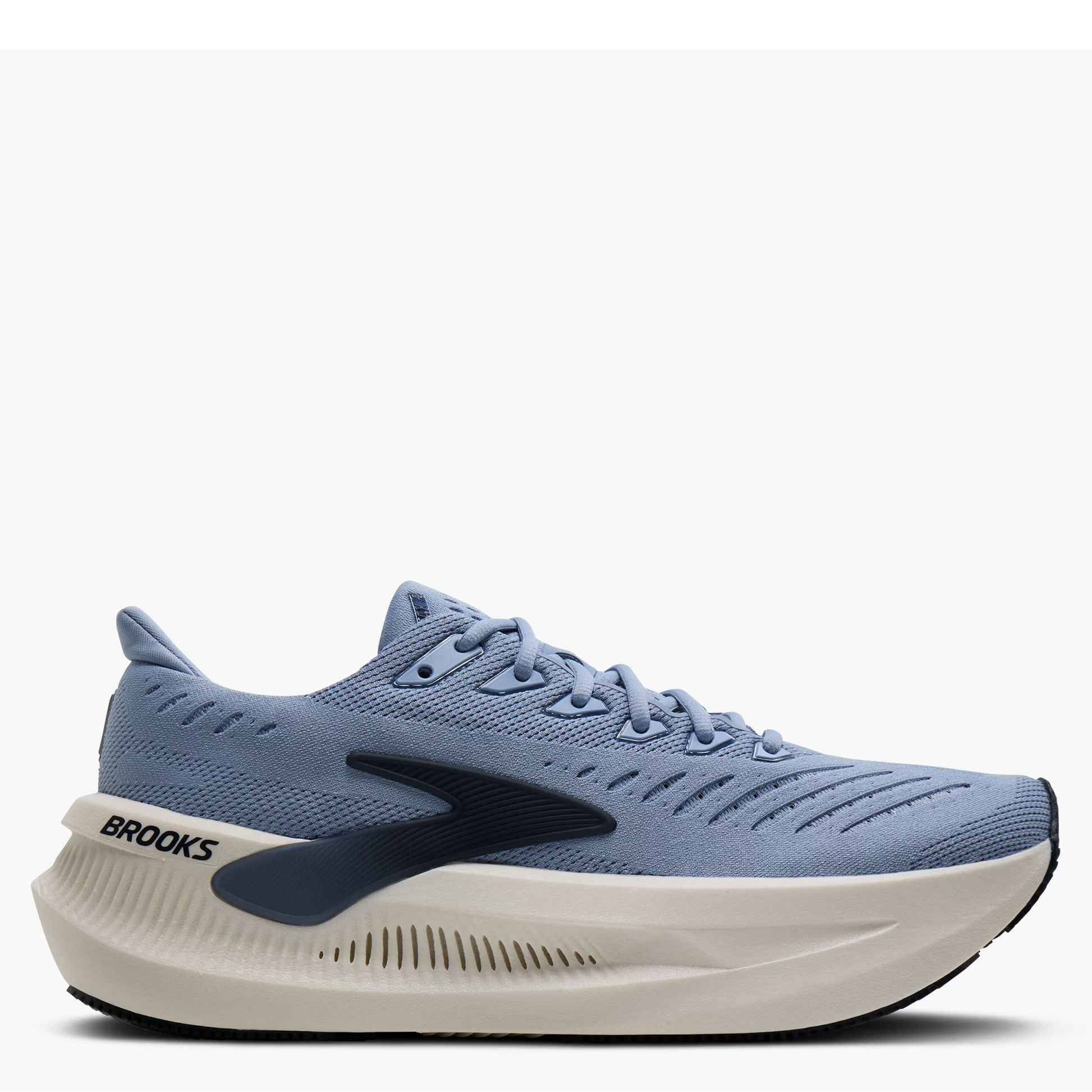 A Brooks running shoe in light blue and navy with a thick cream-colored midsole, shown from the side on a light gray background.