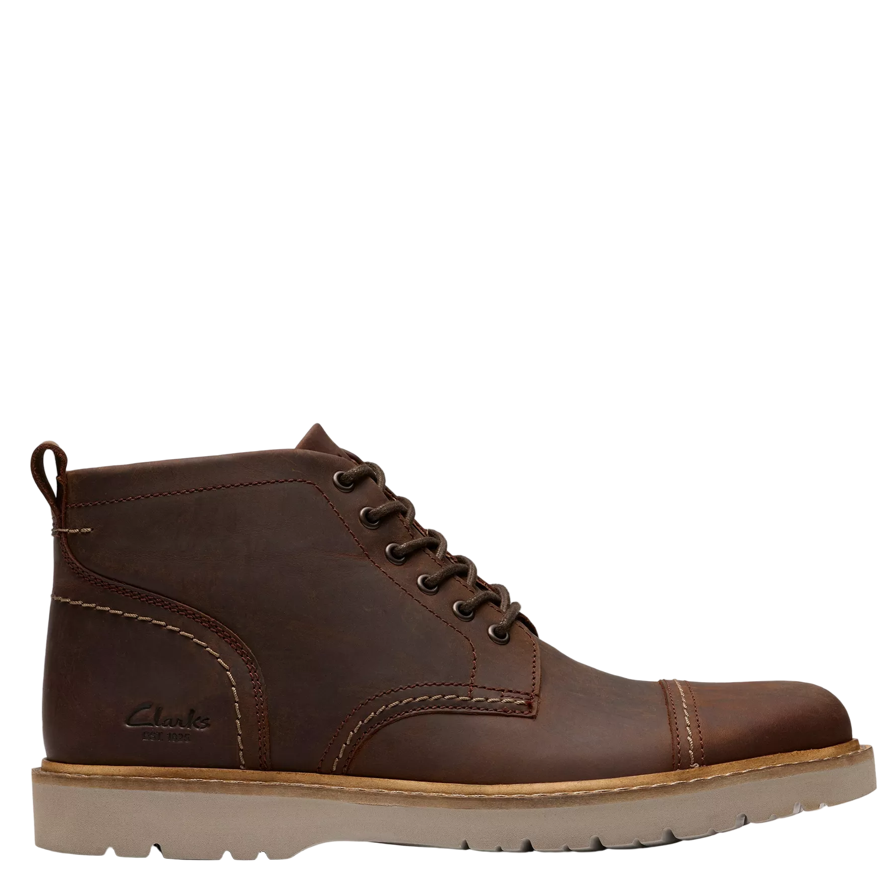 Brown leather boot with a white background